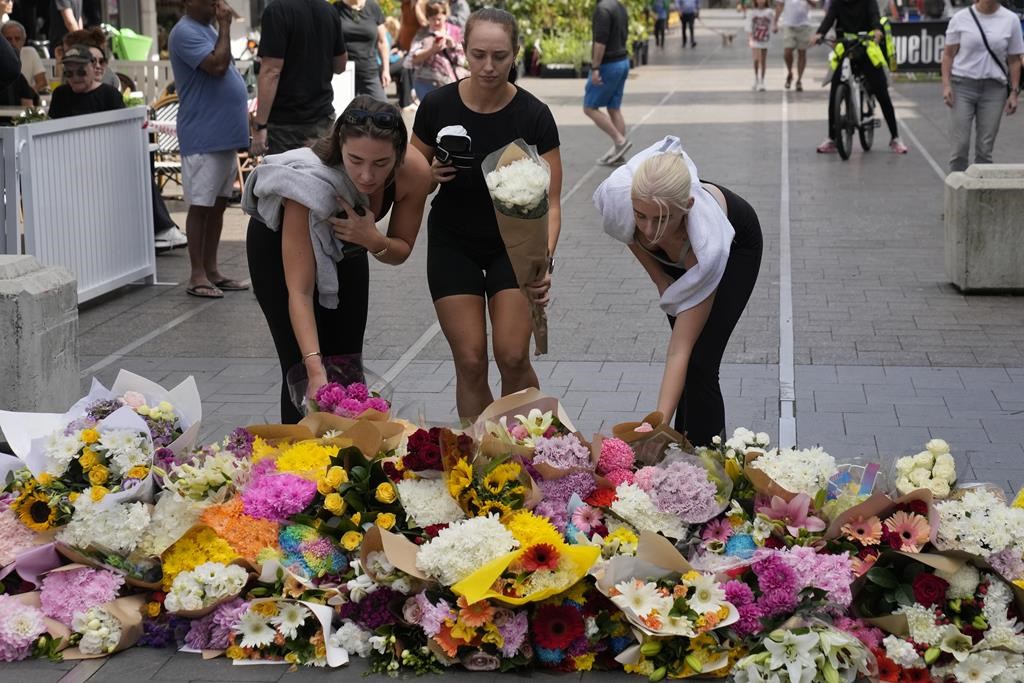 Officer, bystanders hailed for confronting and stopping a man who killed 6 at an Australian shopping mall
