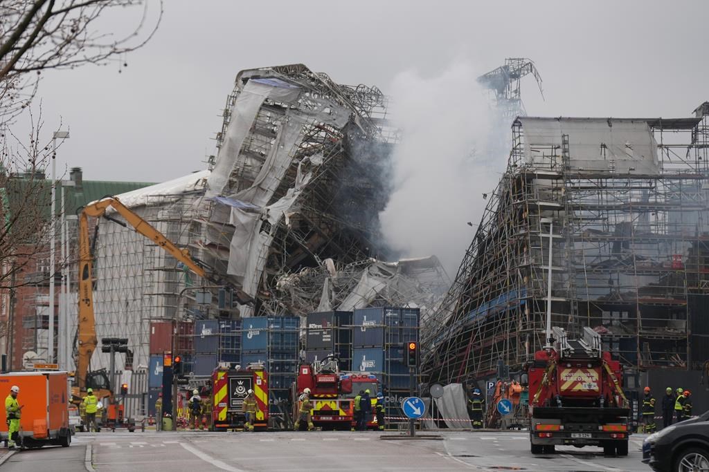 Firefighters to tackle scaffolding dangling outside ruins of fire-ravaged Danish landmark