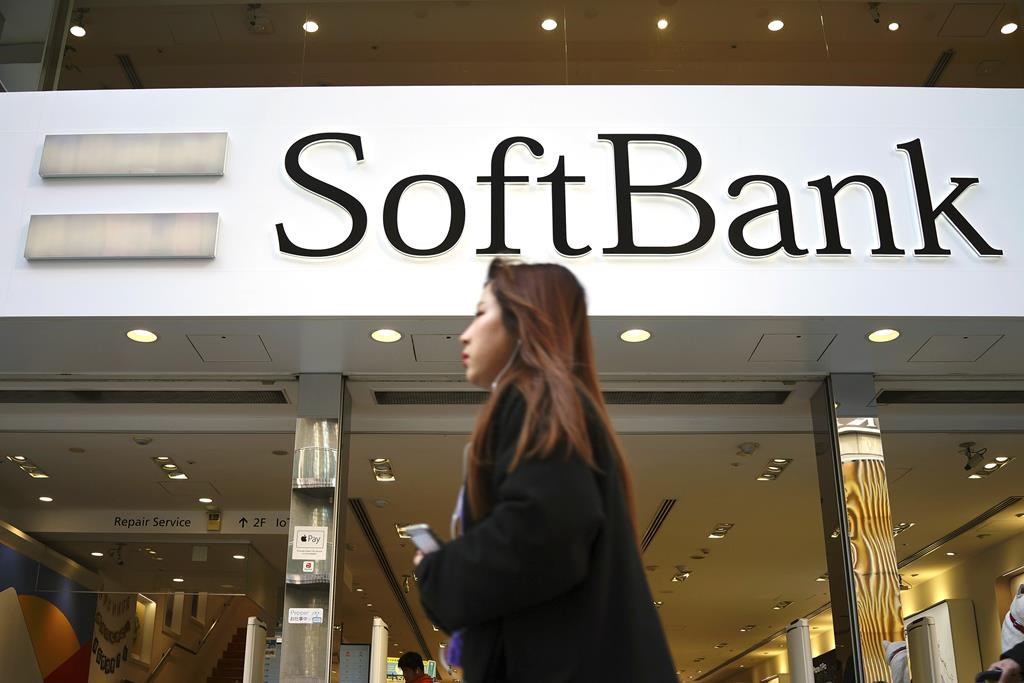 Japan's SoftBank Group trims investment losses but remains in red for fiscal year
