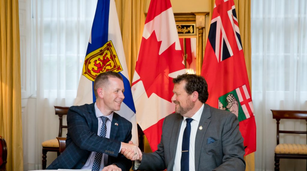 NS____Colton LeBlanc, Nova Scotia's Minister of Acadian Affairs and Francophonie (left), and Glen Simard,