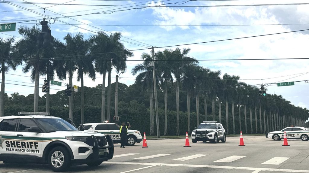 Sheriff vehicles are pictured near Trump International Golf Club