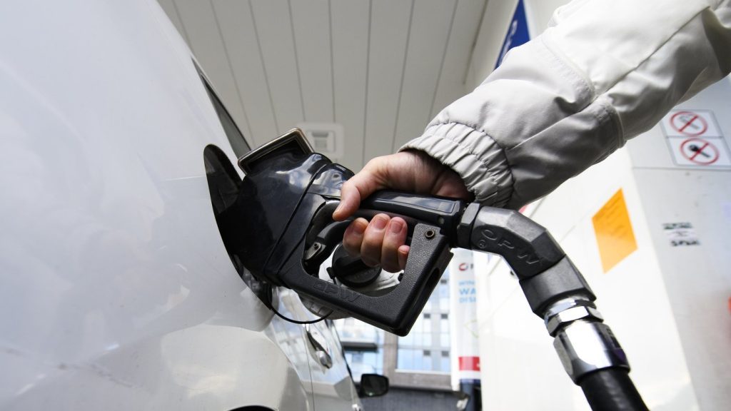 A person pumps gas at a gas station in this file photo