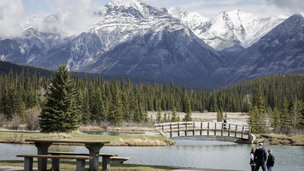 Visitors explore Cascade Ponds in Banff National Park, Alta., Thursday, May 15, 2025. THE CANADIAN PRESS/Jeff McIntosh