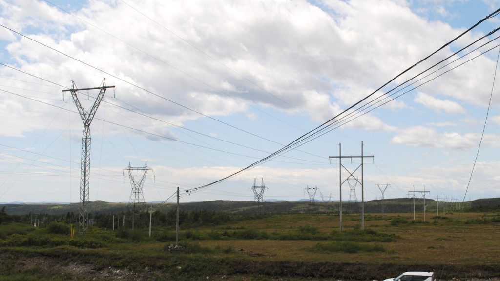 A car is shown driving by a valley of power lines near Come By Chance, N.L., on Saturday, June 28, 2025. Newfoundland and Labrador Hydro says it will soon be looking for companies to provide renewable energy to the province's power grid. THE CANADIAN PRESS/Sarah Smellie