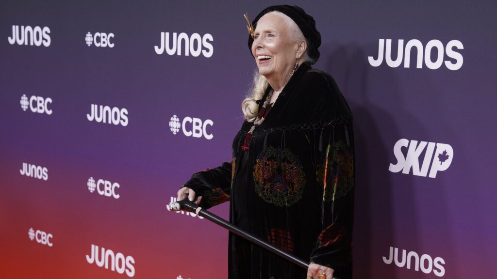 Joni Mitchell, 19-time Juno Award nominee, five-time winner, and the 2026 Lifetime Achievement Award recipient, pose on the orange carpet at the Junos in Hamilton, Ontario, Canada on Sunday, March 29, 2026. THE CANADIAN PRESS/Peter Power