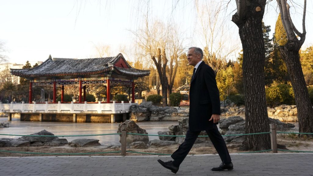 Prime Minister Mark Carney makes his way to hold a press conference in Ritan Park in Beijing, China on Friday, Jan. 16, 2026. THE CANADIAN PRESS/Sean Kilpatrick