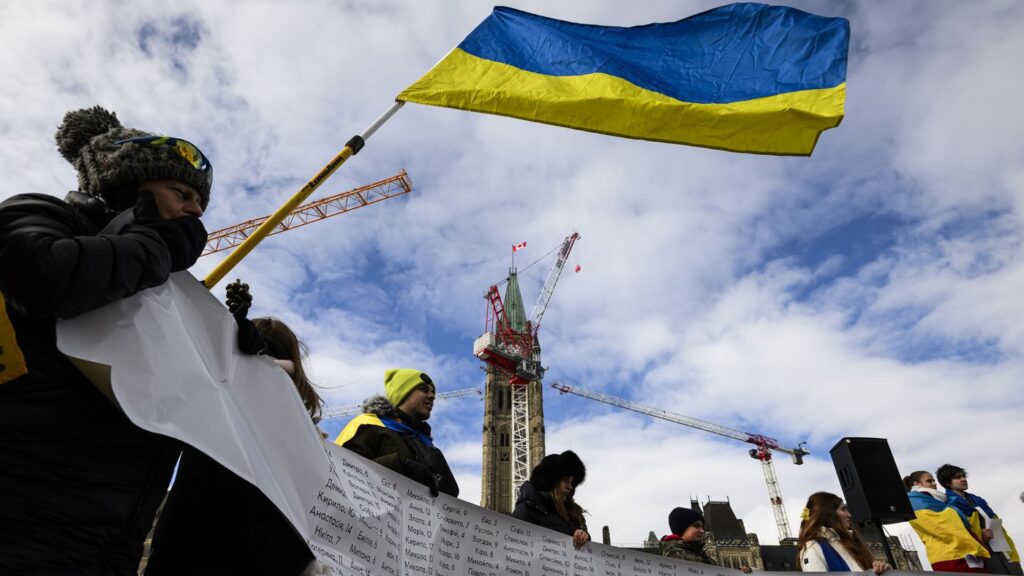 People rally on Parliament Hill to mark the 3rd anniversary of Russia's full-scale invasion of Ukraine, in Ottawa, on Feb. 23, 2025. THE CANADIAN PRESS/Justin Tang