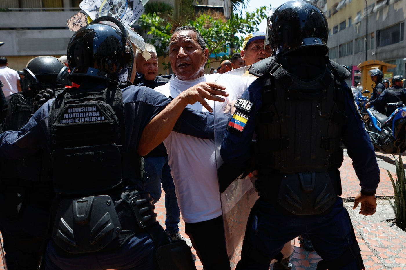 Venezuelan police block protesters demanding higher wages and pensions