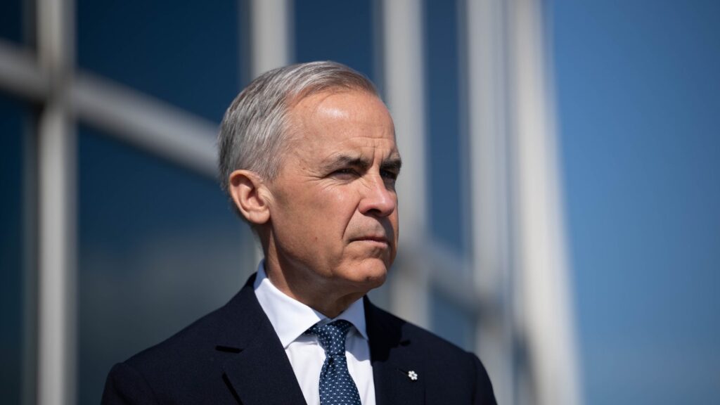 Prime Minister Mark Carney listens as B.C. Premier David Eby, not seen, speaks in Vancouver on Wednesday, May 20, 2026. THE CANADIAN PRESS/Ethan Cairns