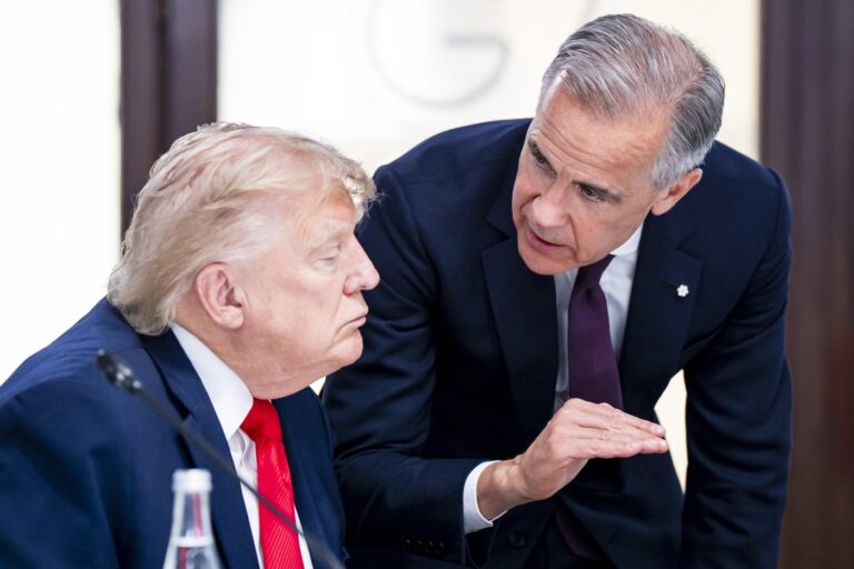 Prime Minister Mark Carney and U.S. President Donald Trump speak at the G7 working luncheon in Evian-les-Bains, France on Tuesday, June 16, 2026. THE CANADIAN PRESS/Christopher Katsarov