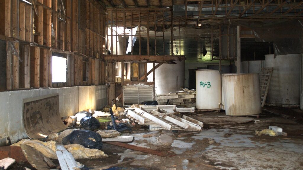 Vats of fermenting fish are shown in a long-abandoned fish-sauce plant in St. Mary's, N.L., on Thursday, June 12, 2025. THE CANADIAN PRESS/Sarah Smellie